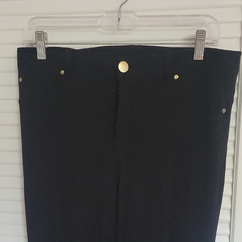 IMAN Black Garment with Gold Label